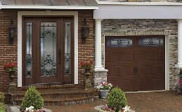 Arbor Grove Fiberglass Entry Door with Prescott Glass and coordinating garagy door - Gallery Steel